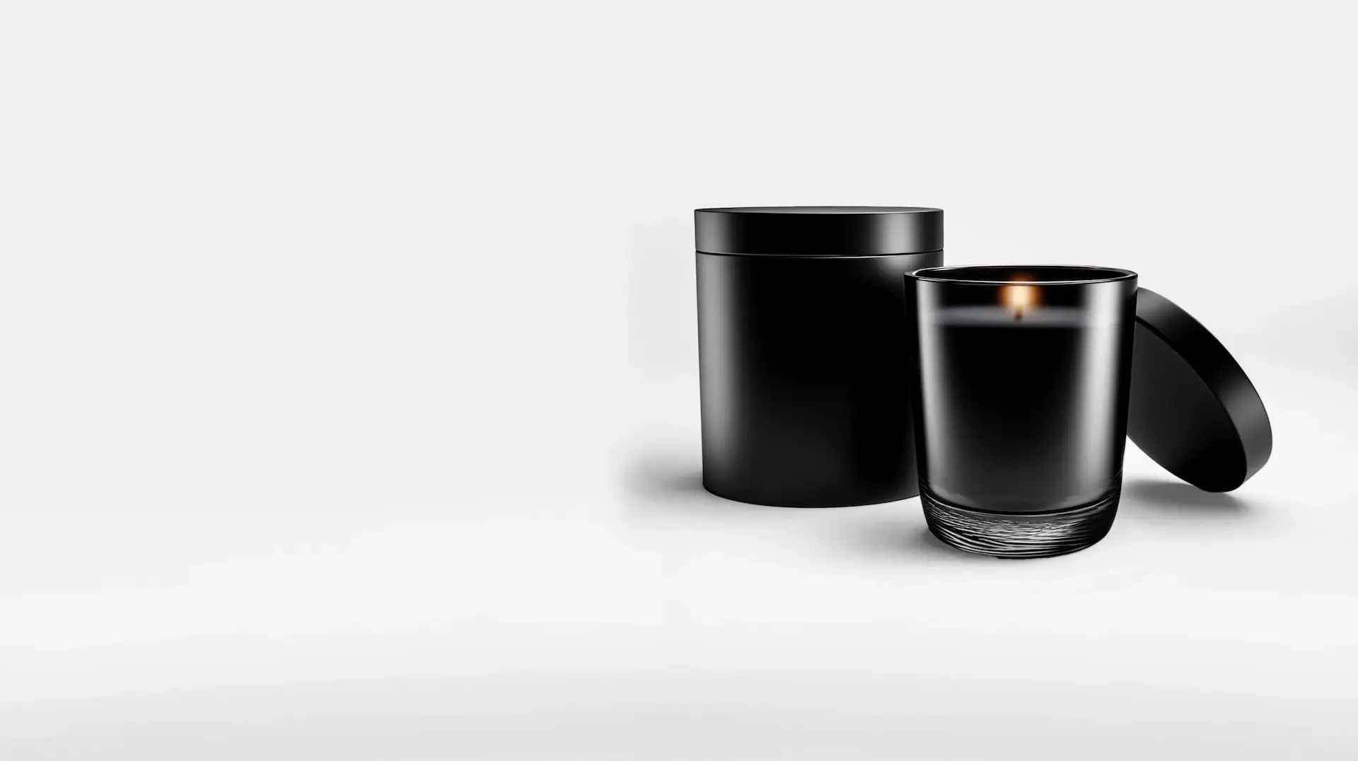 Bougie parfumée dans un verre noir avec son couvercle