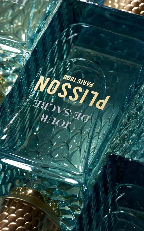 Close-up of a Plisson perfume bottle